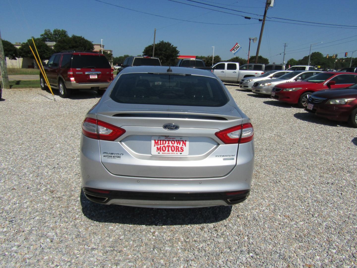 2016 Silver Ford Fusion Titanium (3FA6P0K96GR) with an 2.0L L4 DOHC 16V engine, Automatic transmission, located at 15016 S Hwy 231, Midland City, AL, 36350, (334) 983-3001, 31.306210, -85.495277 - Photo#6